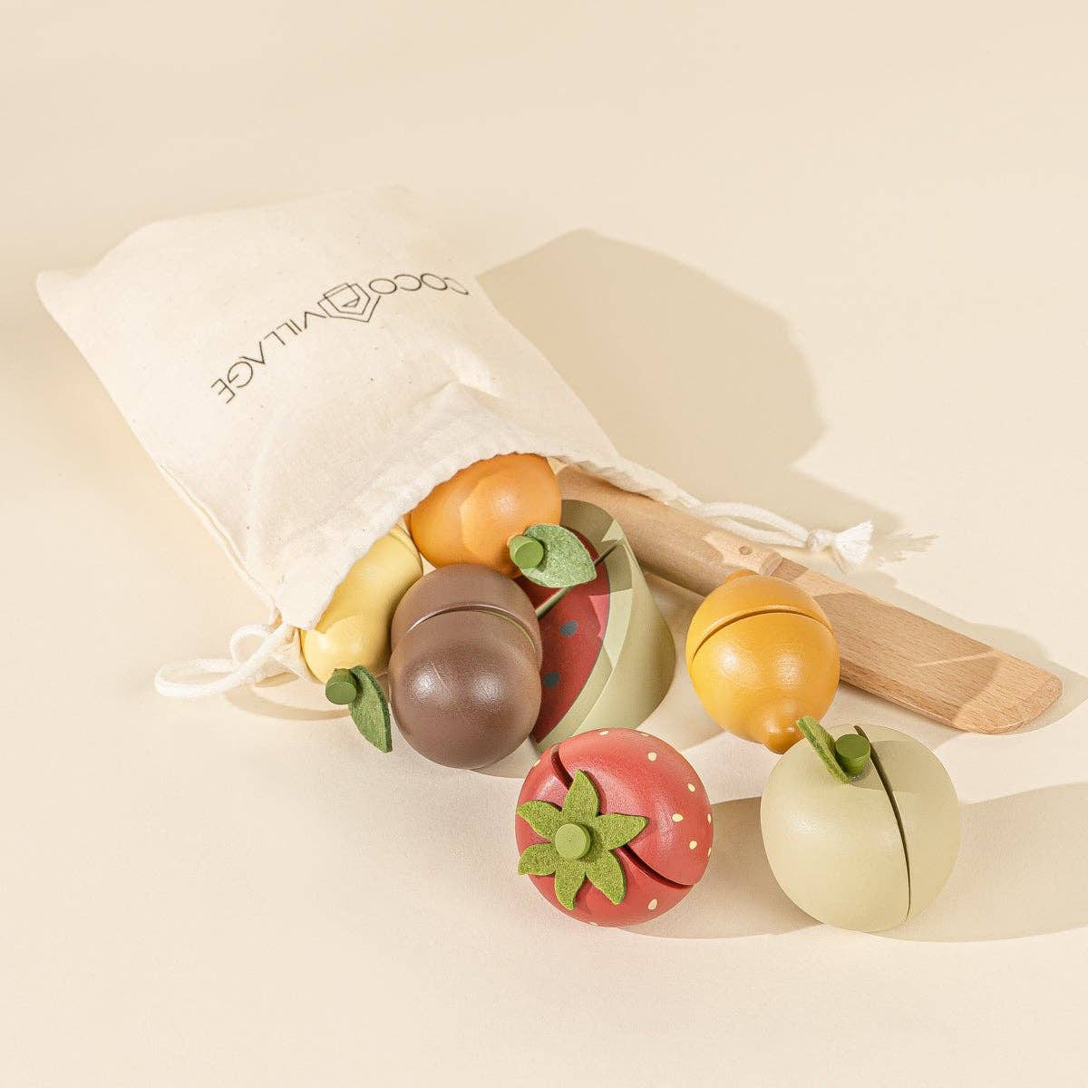 Set of colorful wooden fruit toys with a white drawstring bag 