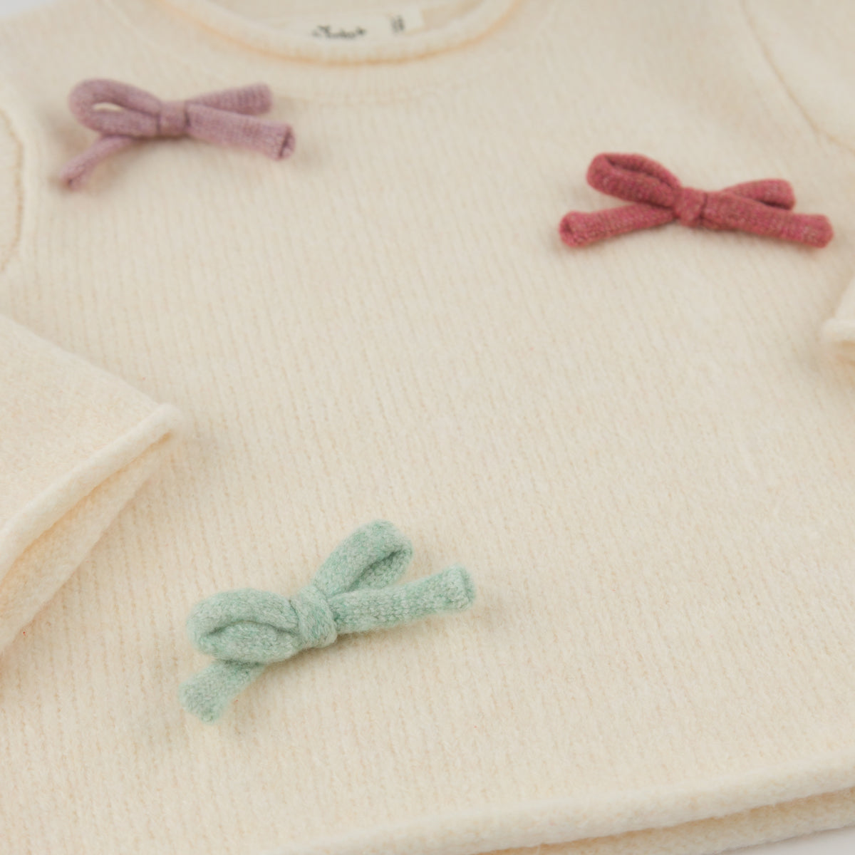 oh baby! Roll-Edge Knitted Pullover Sweater - Multi Bows - Cream - Close Up Front