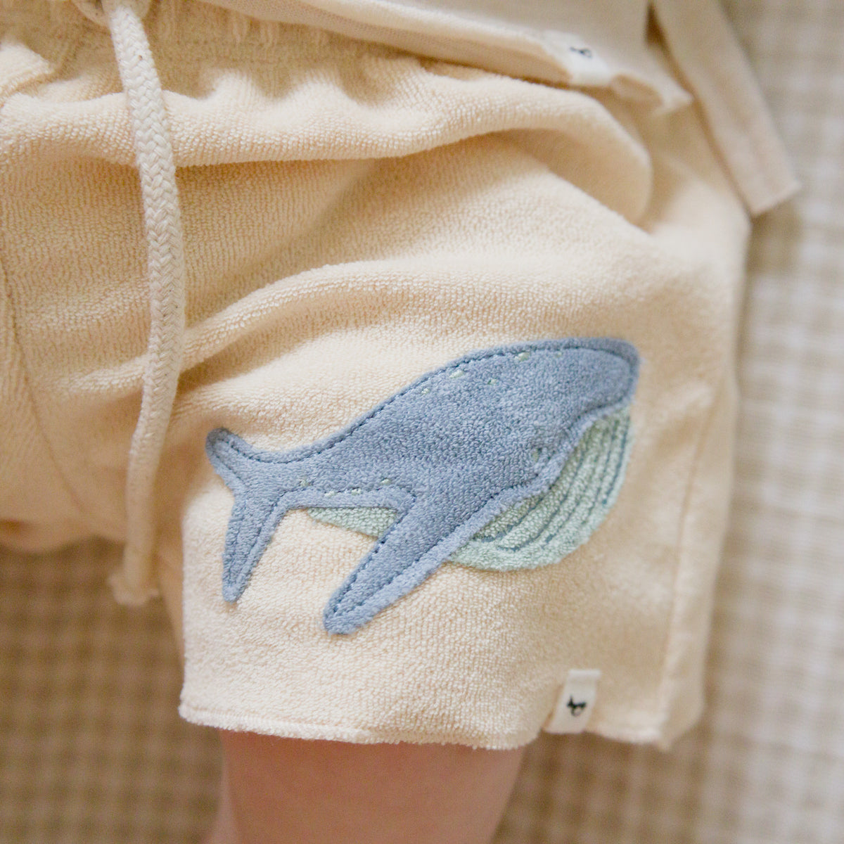 oh baby! Charlie Short - Whale Applique - Buff - Lifestyle Applique Close