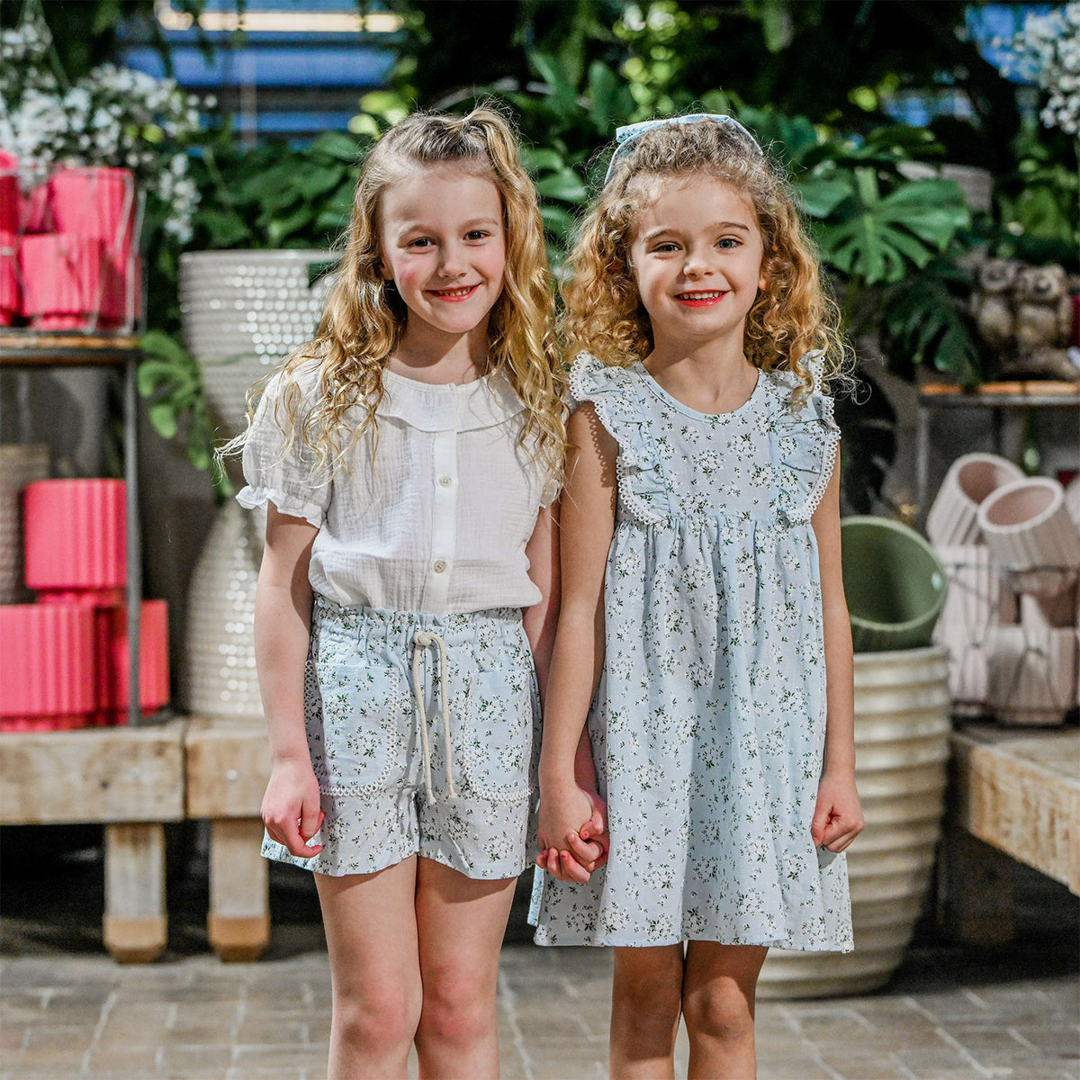 oh baby! Libby Pocket Short - Apple Blossom - Sky Blue with Sky Blue Dress - Lifestyle Girls Holding Hands