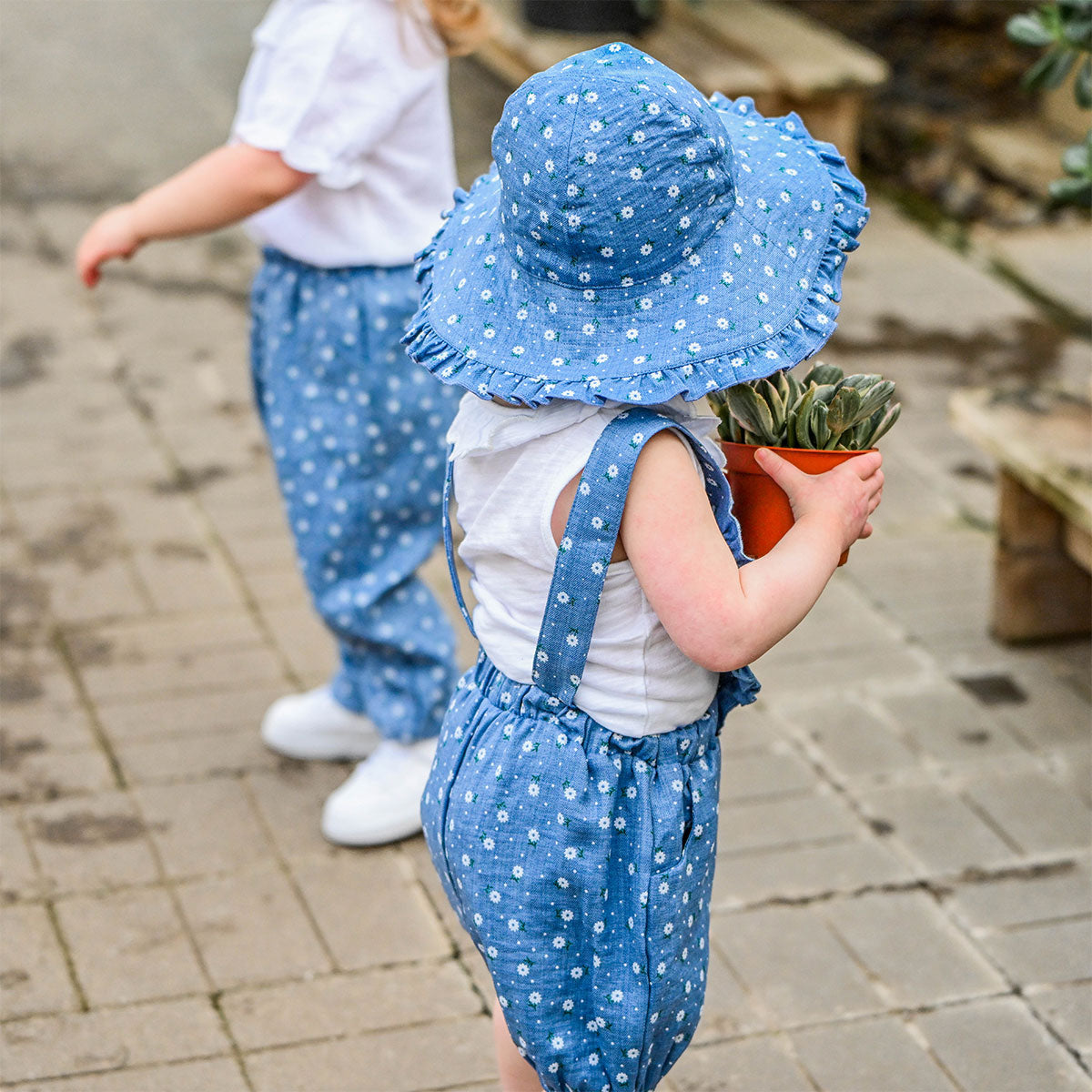 oh baby! Darling Romper - Sunburst Flower Print - Denim - Back