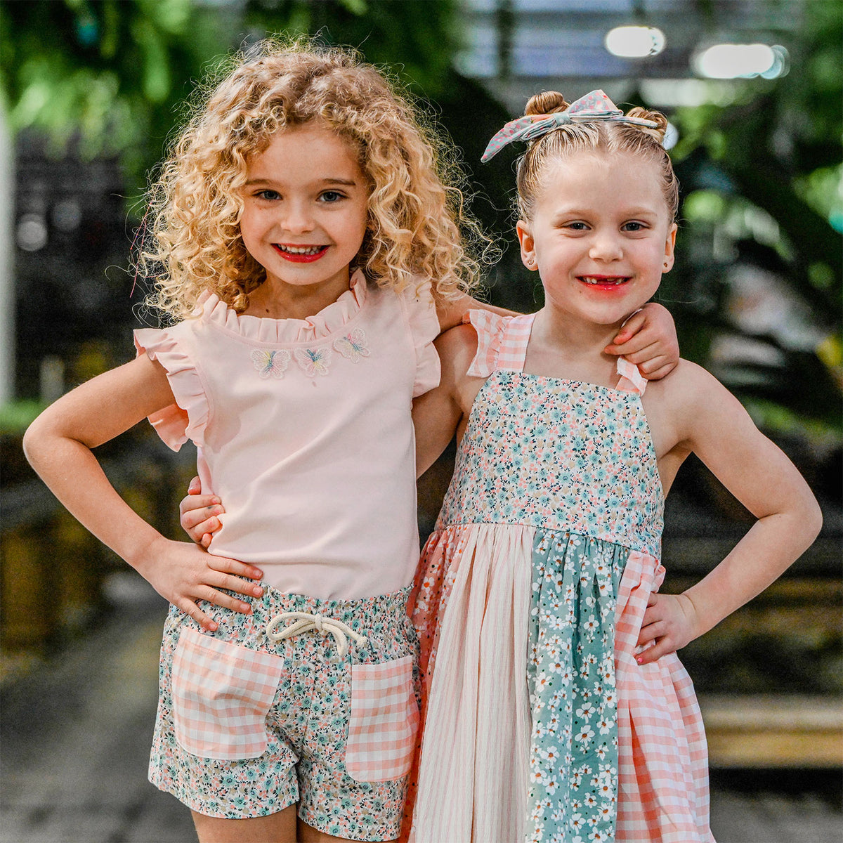 Garden Party Libby Pocket Short and Rebekah Tank with Charlotte Dress Lifestyle Girls with arms around each other